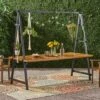 Huckleberry Rectangle Acacia Wood Patio Dining Table With Iron Plant Hanger Teak/Black - Christopher Knight Home 1 Huckleberry Rectangle Acacia Wood Patio Dining Table With Iron Plant Hanger Teak/Black - Christopher Knight Home -Outdoor Furniture Store GUEST f47a3131 4b1a 40c5 b1df cf7788b0f2c1